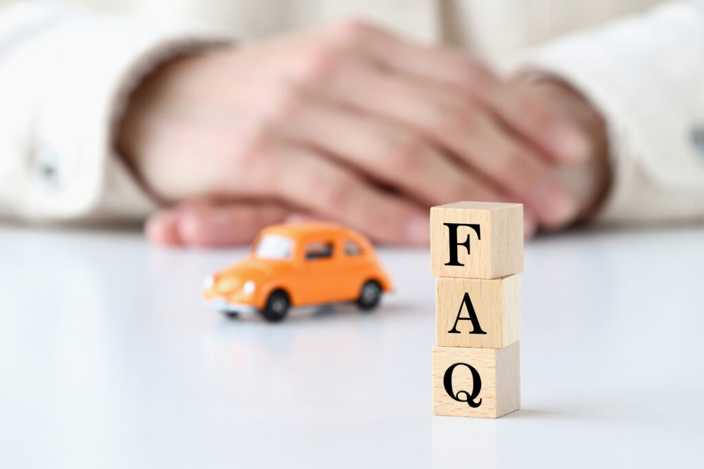 Human thiking about car and wooden blocks with FAQ word FAQ